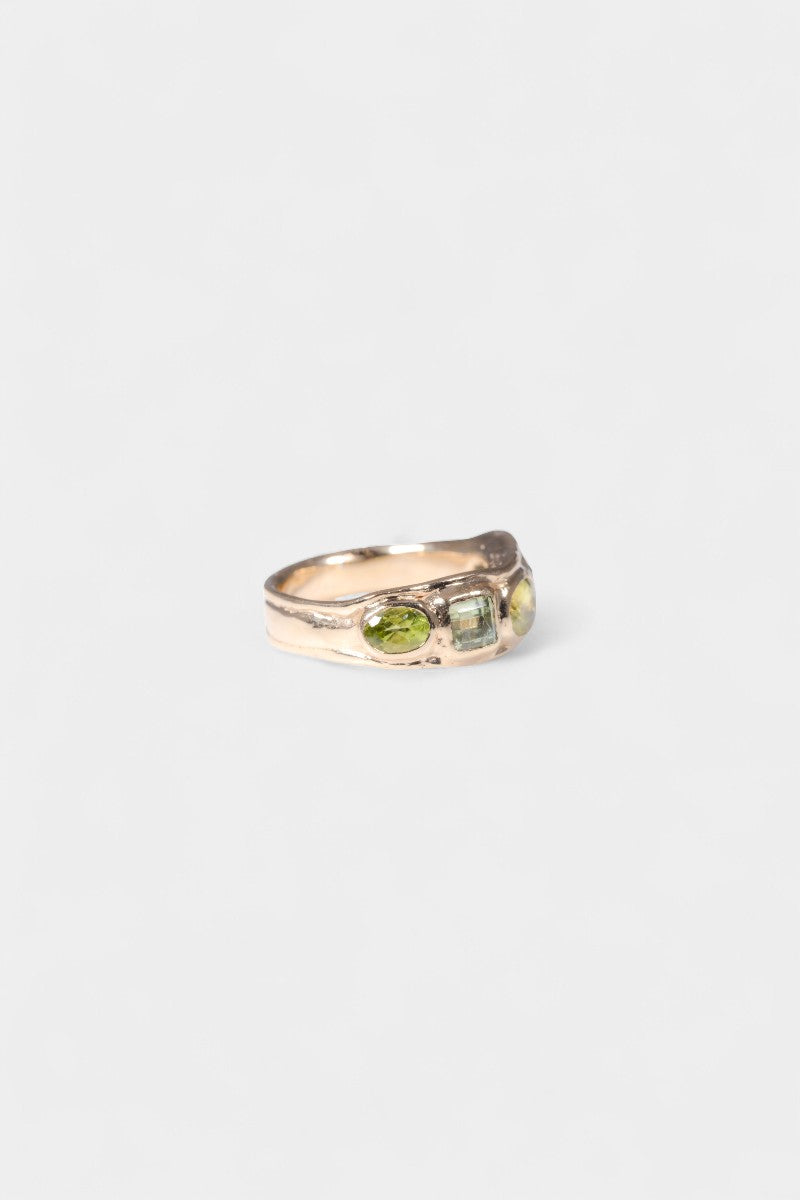 Boogie Wonderland Ring left side
solid 9 karat yellow gold with all natural stones: emerald cut mint green tourmaline, oval cut sphene, square cut mint green tourmaline, oval cut peridot