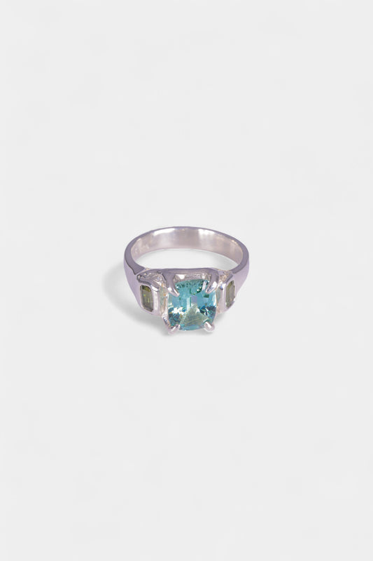 Frozen Fresh Ring
sterling silver with all natural stones: emerald cut pale green tourmaline, two pale green sapphires.