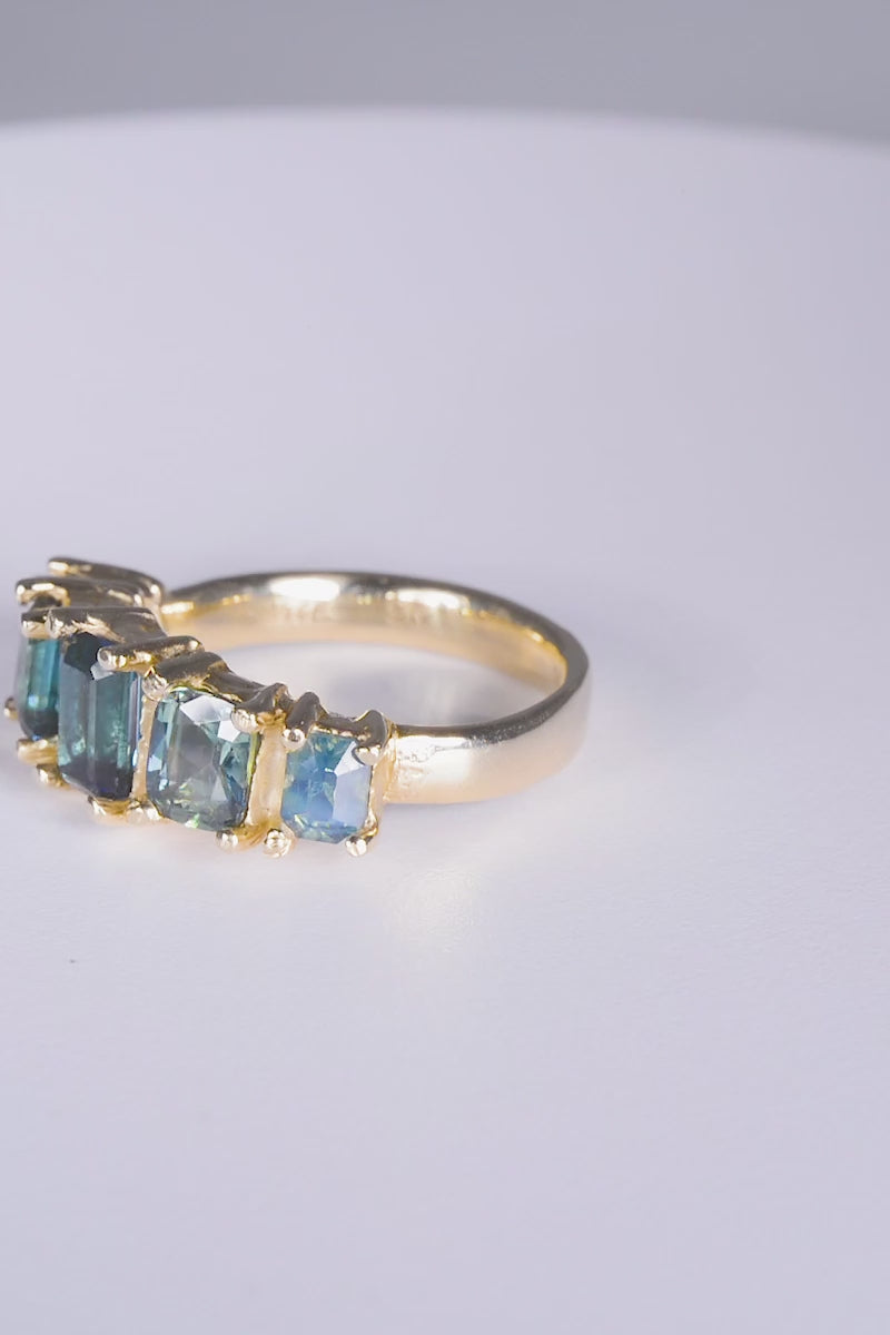 Garage Ring
solid 9 karat yellow gold with all natural stones: tourmalines, blue sapphires. This ring is a size Q or US 8. 