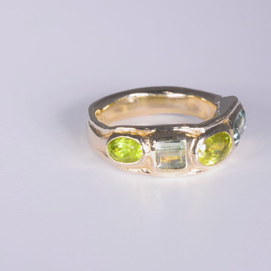 Boogie Wonderland Ring
solid 9 karat yellow gold with all natural stones: emerald cut mint green tourmaline, oval cut sphene, square cut mint green tourmaline, oval cut peridot